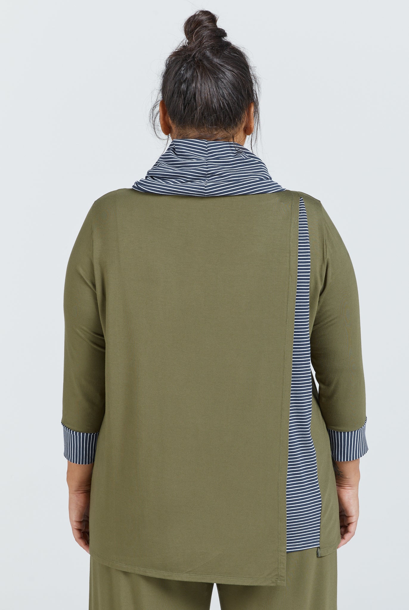 Cowl Neck Leaf Back Top shown from behind in olive green with striped navy and white contrast collar and cuffs. Model wearing hair in top knot displays three-quarter length sleeves and relaxed fit design with subtle back detail.
