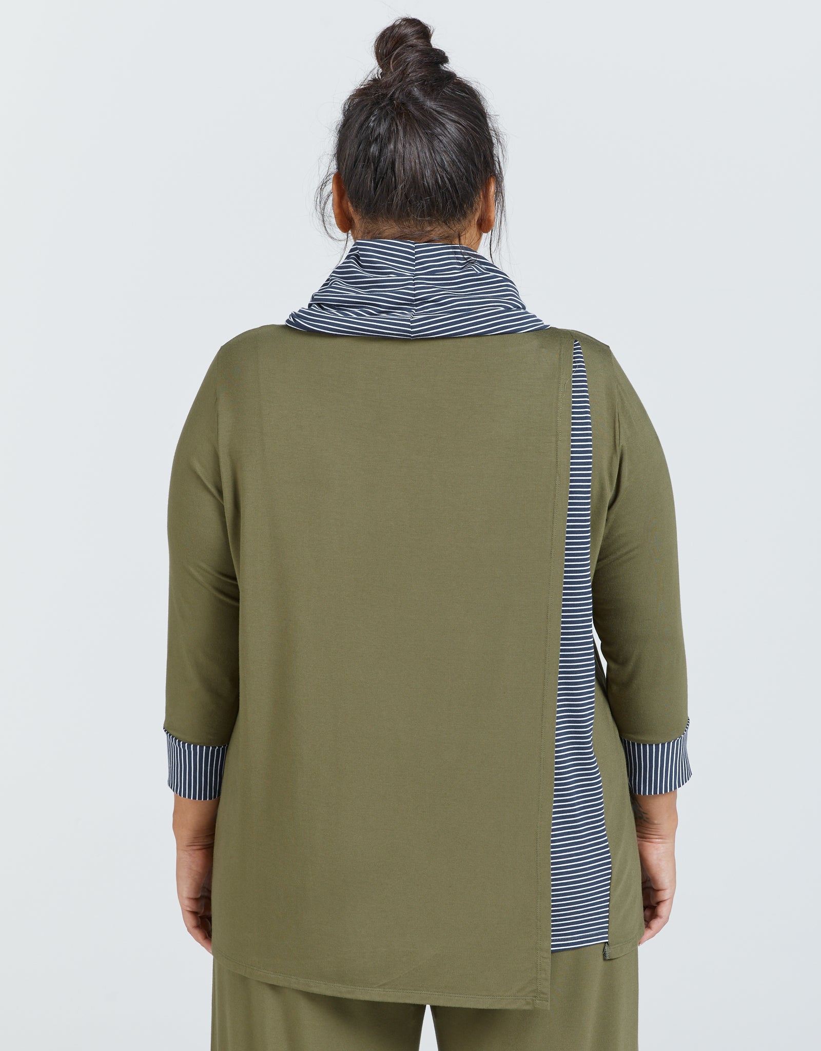Cowl Neck Leaf Back Top shown from behind in olive green with striped navy and white contrast collar and cuffs. Model wearing hair in top knot displays three-quarter length sleeves and relaxed fit design with subtle back detail.