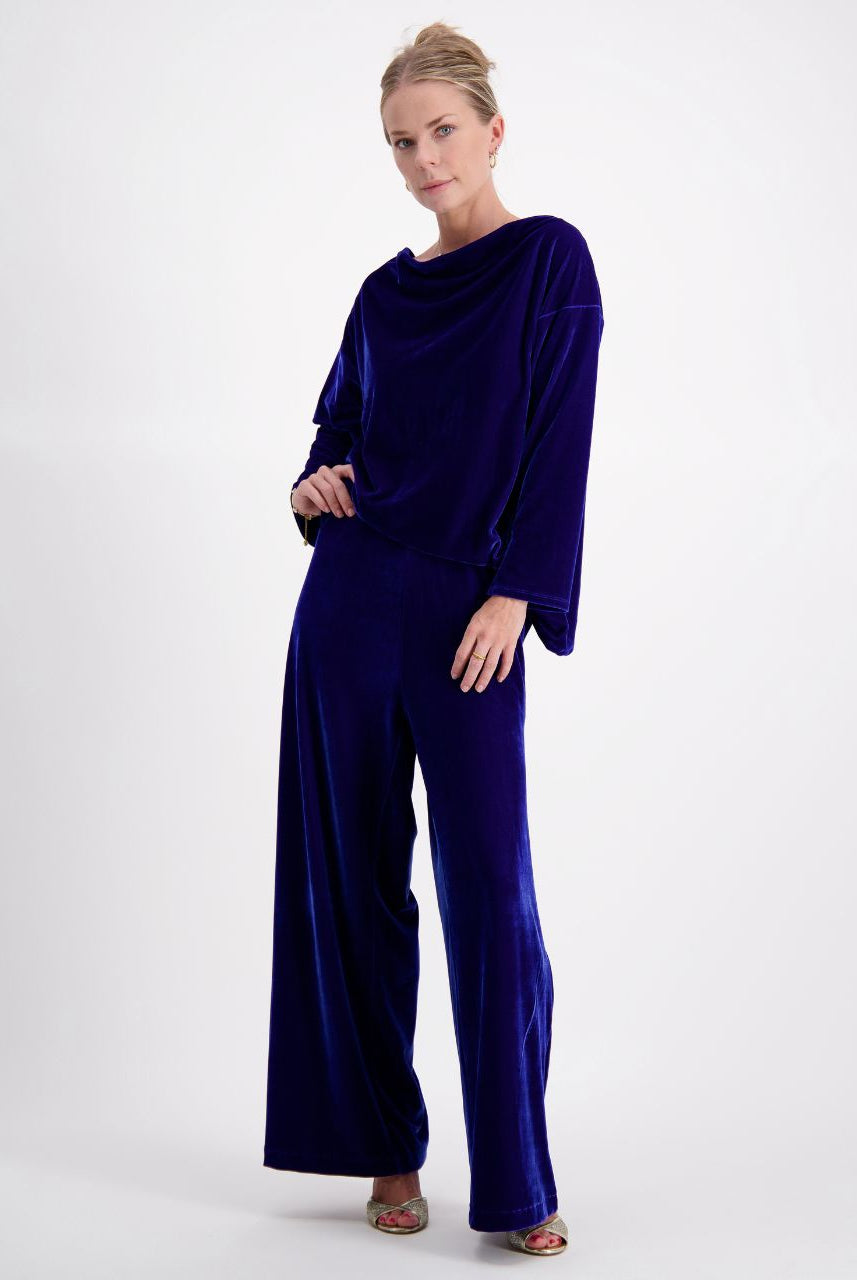 Emma Boat Neck Leaf Back Top in luxurious cobalt blue velvet, featuring elegant wide-leg pants, boat neckline, and three-quarter length sleeves. Showcased in a sophisticated full-length pose against a light background, highlighting the plush texture and flowing silhouette.