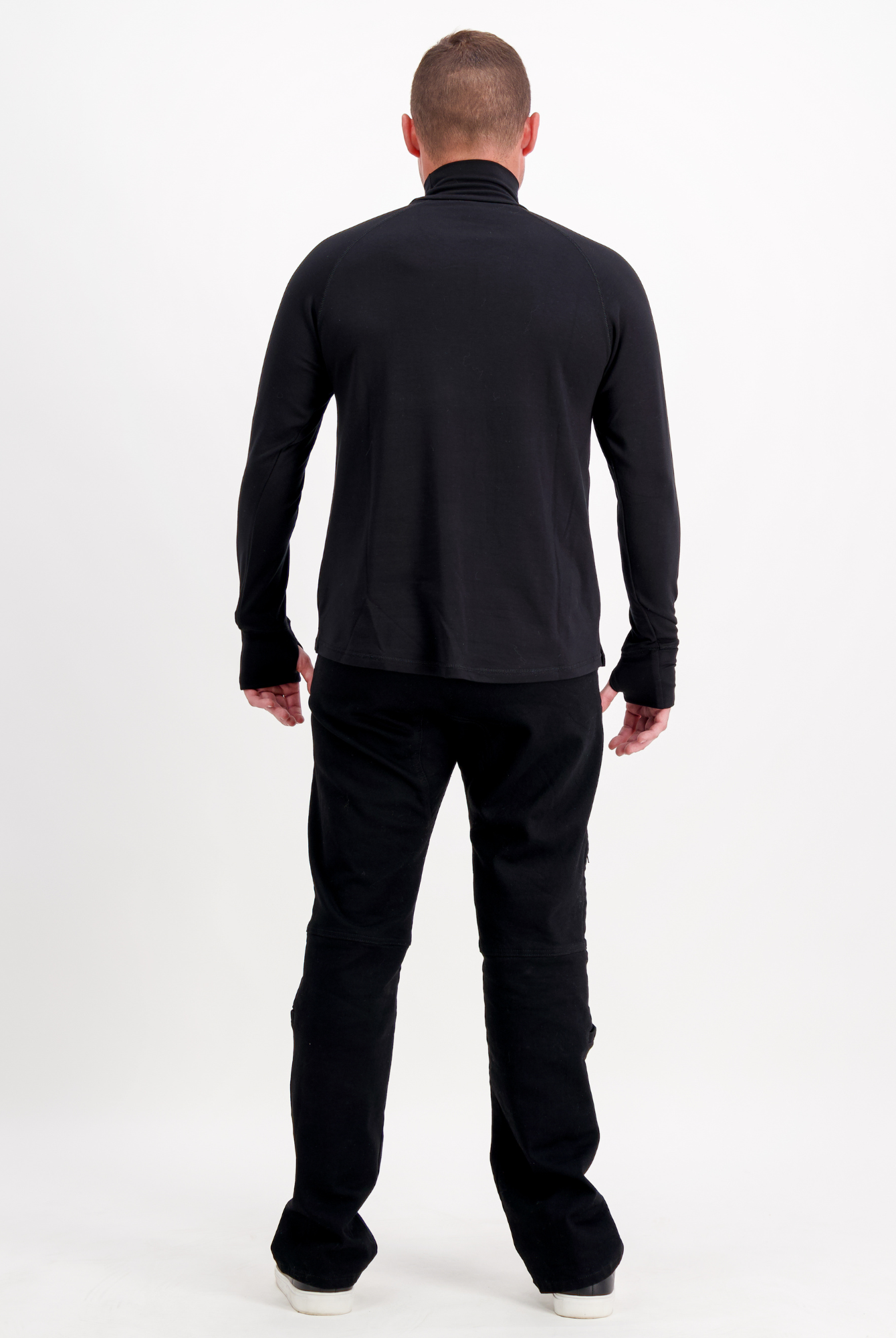 Back view of the Louis Thermal Top in classic black, showing sleek turtleneck design and comfortable fit from shoulders to waist, paired with black pants against white background, demonstrating versatile casual style