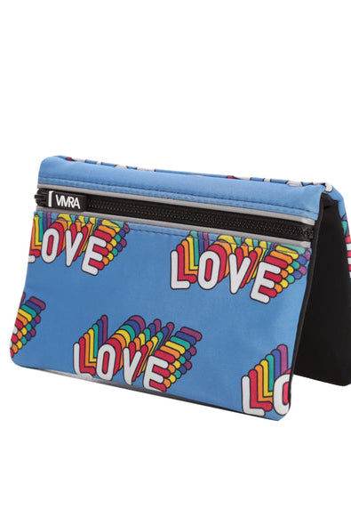The VIVRA ‘Vivid’ waist bag in a vibrant blue adorned with colourful, rainbow-patterned 'LOVE' text, a black zipper, and the brand tag that says, ‘Vivra’, set against a white background.
