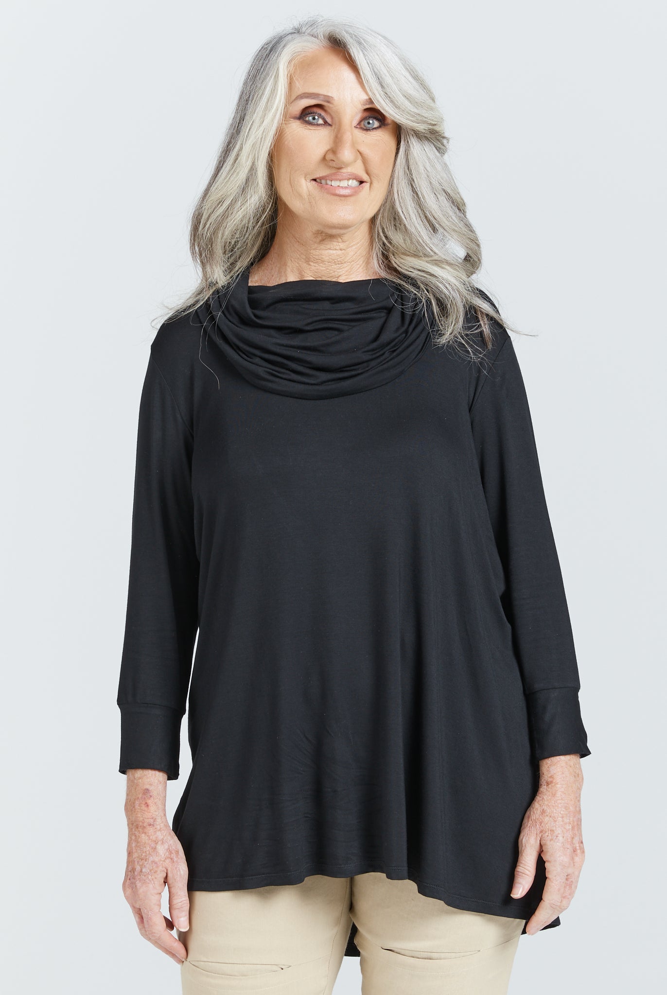 Cowl Neck Leaf Back Top in classic black bamboo fabric with elegant draped neckline and 3/4 sleeves, shown in a studio setting against a white background. The top features a relaxed fit with a subtle back split detail and modesty layer.