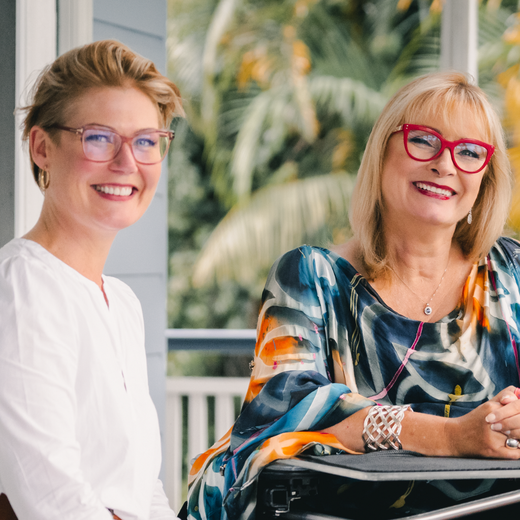 Founder and leader designer of Christina Stephens seated next to each other smiling.