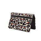 The VIVRA ‘Vivid’ waist bag in a bold leopard print pattern in shades of black, beige, and burnt orange, featuring a black zipper and a brand tag that says, ‘Vivra’, set against a white background.