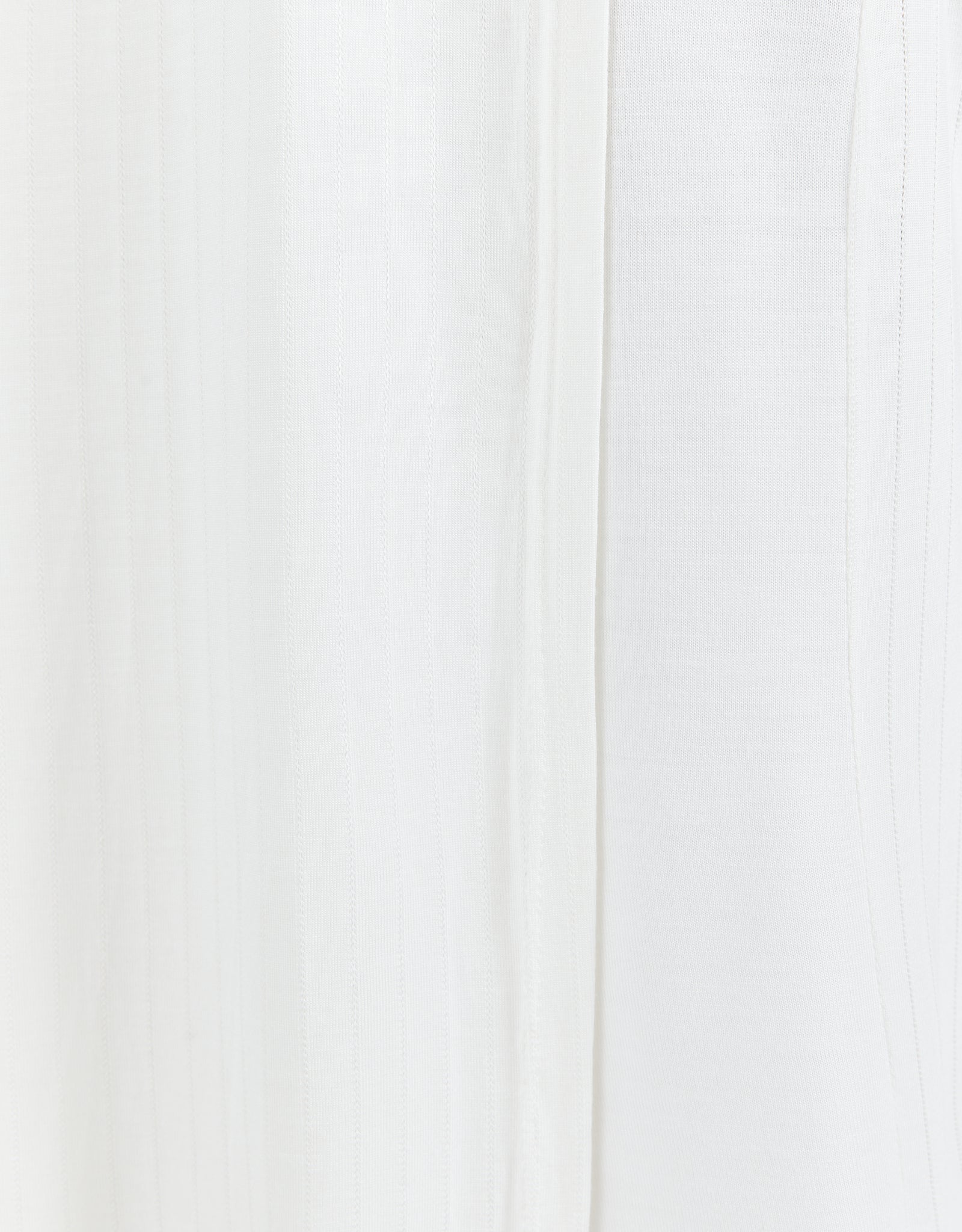 Essensual PJ Top in pure white fabric, featuring a soft, flowy texture with subtle vertical seam detail. This elegant sleepwear piece showcases a minimalist design perfect for comfortable nighttime wear.